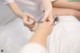 A woman getting a foot massage at a spa.